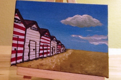 Beach-huts-with-easel